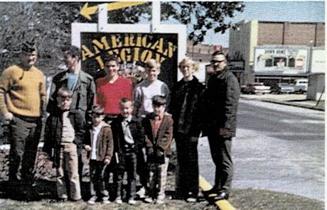 Group photo of members by first sign.